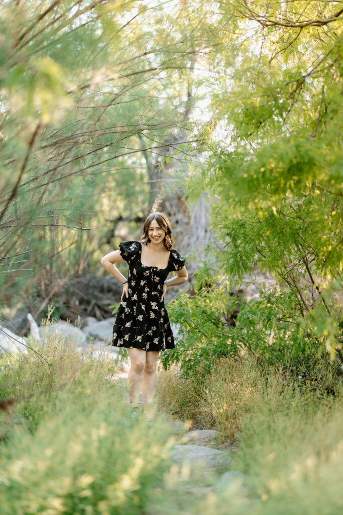 Senior photo session in the green grass at Water Users Recreation Site, Salt River, Mesa, Arizona.