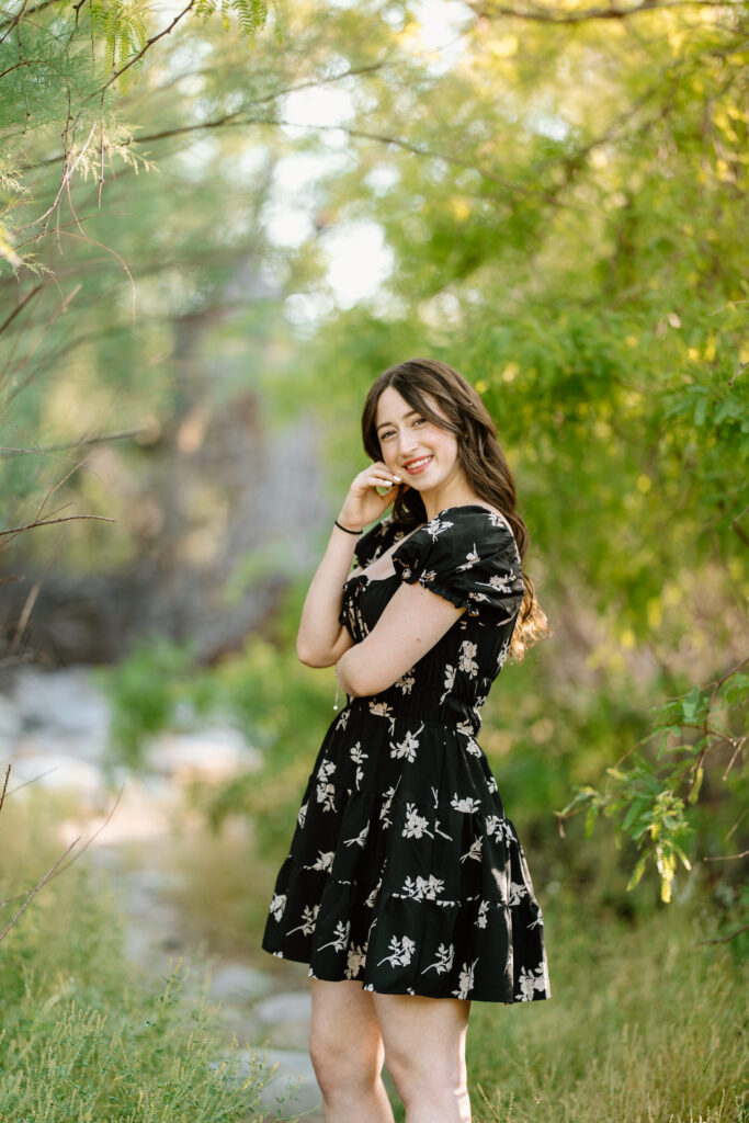 Senior photo session in the green grass at Water Users Recreation Site, Salt River, Mesa, Arizona.